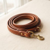 Bridle Leather Lead in vegetable-tanned leather with a solid brass trigger clip, loosely coiled