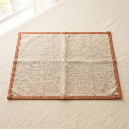 Linen Feeding Mat in heavy washed linen with a narrow terracotta binding