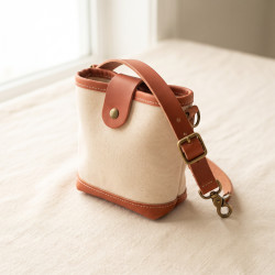 Canvas Walk Pouch in waxed canvas with a leather flap and brass clip