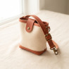 Canvas Walk Pouch in waxed canvas with a leather flap and brass clip