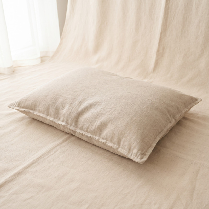Washed Linen Cushion Bed, a low flat cushion bed with an oat washed linen cover