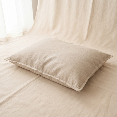 Washed Linen Cushion Bed, a low flat cushion bed with an oat washed linen cover